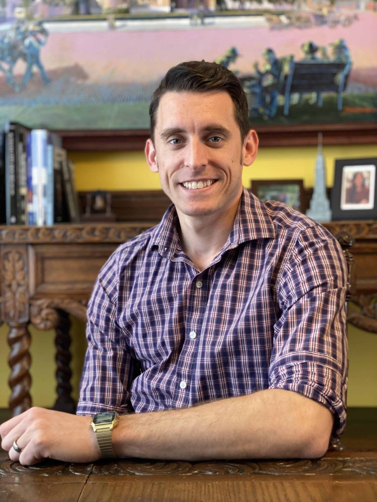 Josh Smead headshot wearing a purple shirt